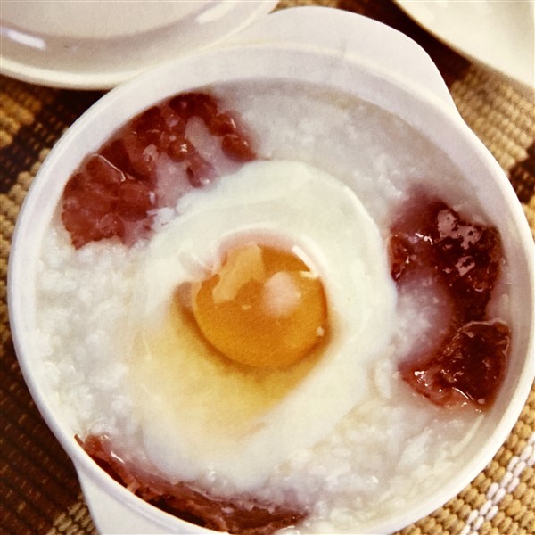 Chinese Beef Tenderloin Congee Served with Egg at Breakfast