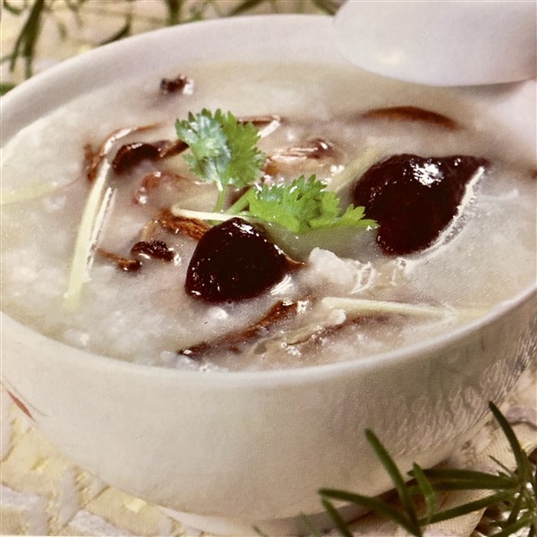 Delicious Chinese Congee With Chestnut Mushrooms And Squid 