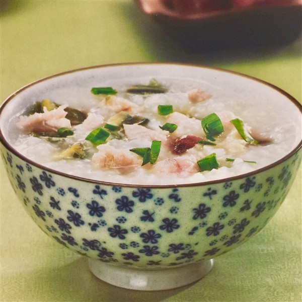 Chinese Pork And Century Egg Congee Served In Bowl