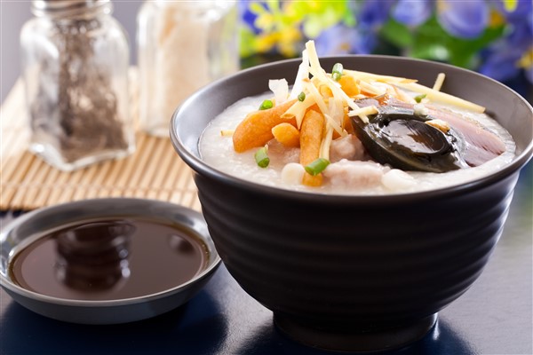 Traditional Congee with Scallion Topping and Century Egg Accompaniment