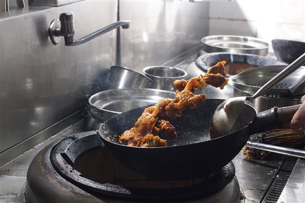 Chinese Chef Using Essential Cooking Techniques