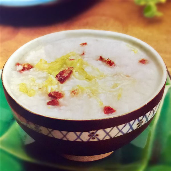 Chinese Beef And Lettuce Congee Served To Group Of People