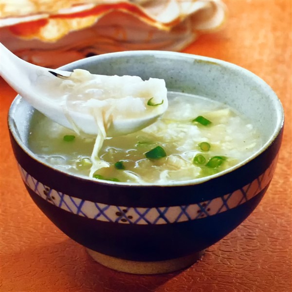 Chinese Chicken Congee with Scallops Served at Dinner