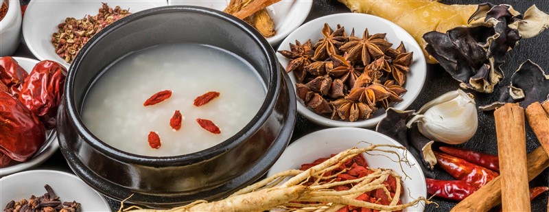 Chinese Congee Surrounded By Many Different Types Of Medicine And Herbs