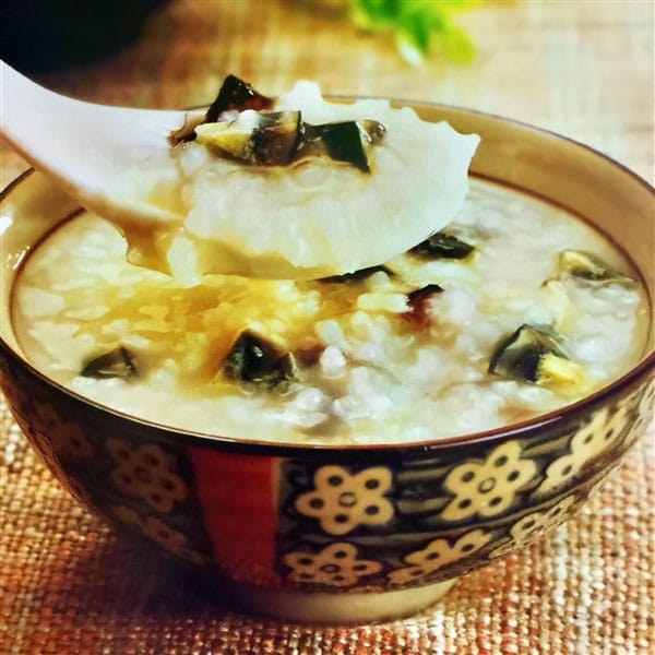 Delicious Chinese Siu Pork Century Egg Congee