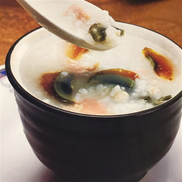 Chinese Chicken And Century Egg Congee With Ham At Dinner