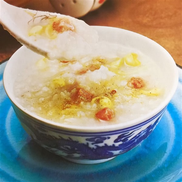 Chinese Congee With Beef Balls And Bean Sprouts Being Served