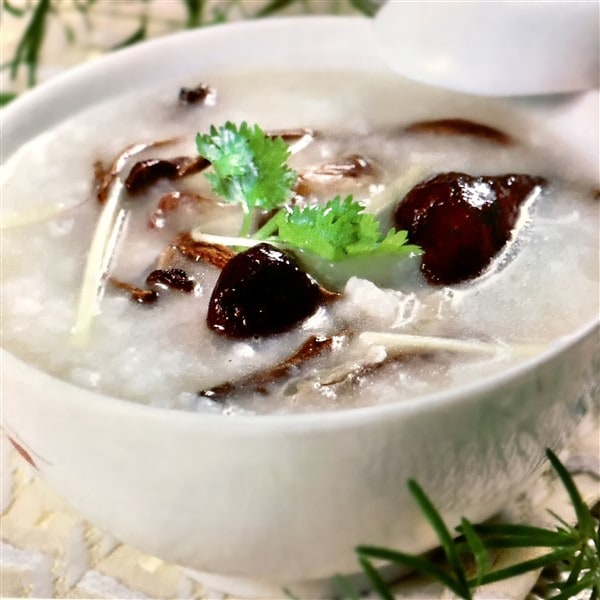 Delicious Chinese Congee With Chestnut Mushrooms And Squid