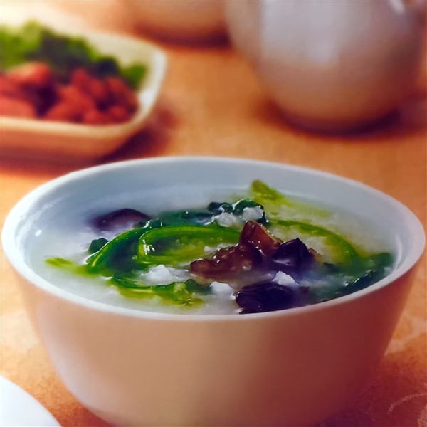 Chinese Congee With Spinach And Black Fungus Served At Dinner