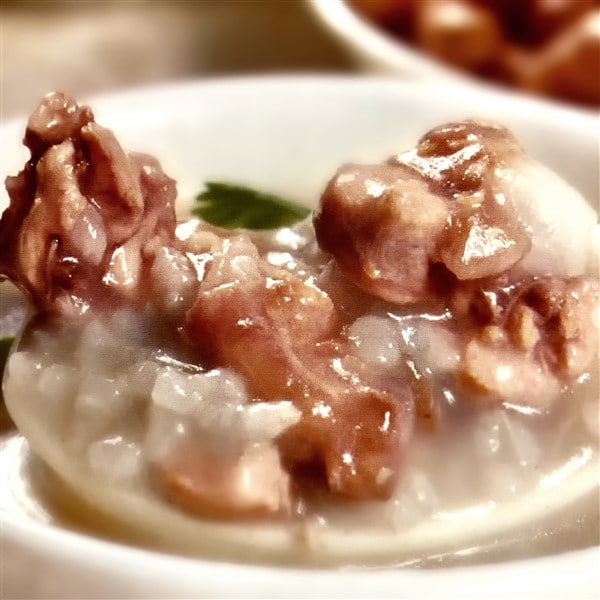 Chinese Duck Congee With Scallops And Mushrooms Served In Traditional Chinese Bowl