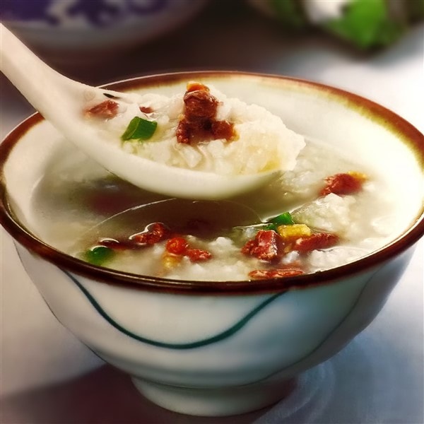 Chinese Squab Congee Being Served At Dinner