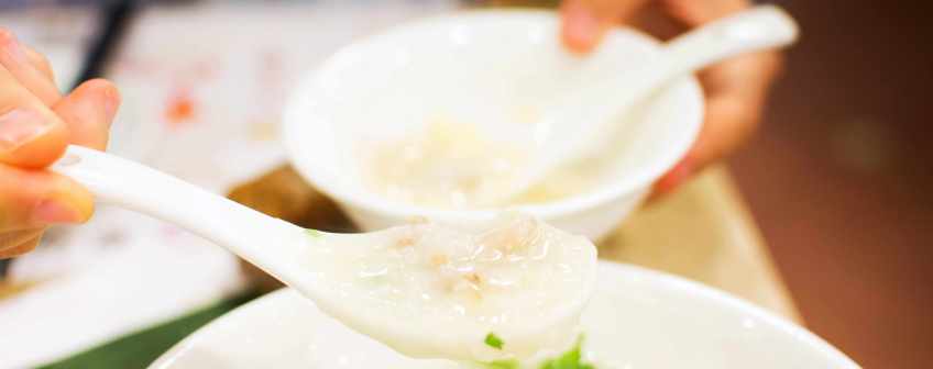 Lean Pork Congee Being Served at a Family Restaurant in Beijing 