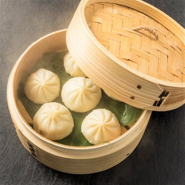 Juicy Chinese Xiao Long Bao Served In Bamboo Steamer At Dim Sum