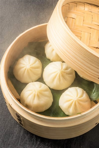 Juicy Chinese Xiao Long Bao Served In Bamboo Steamer At Dim Sum